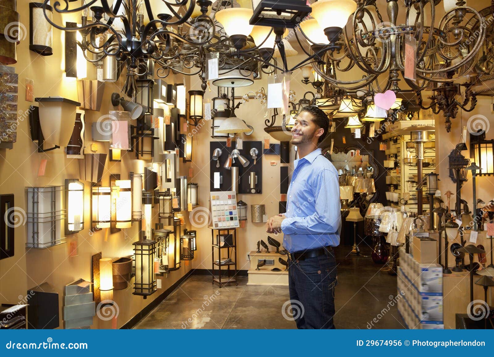 Happy Young Man Browsing Lights Fixture Store Stock Photos Free
