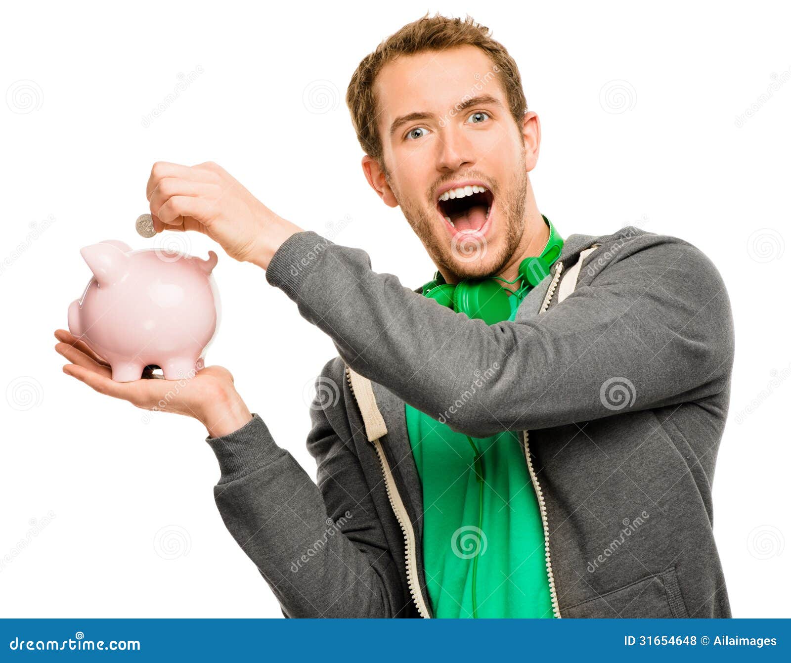 Happy Young Man Putting Money In Piggy Bank Isolated On White