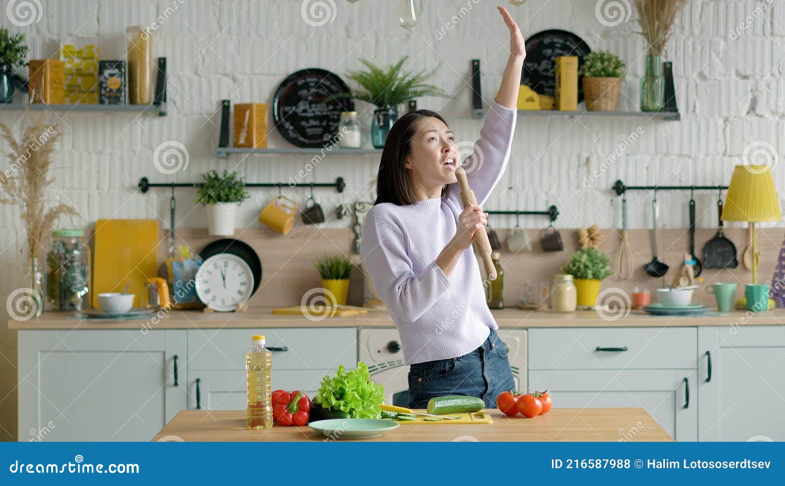 Happy Young Mixed Race Girl Holding Beater Microphone Singing Song Dancing  Listening To Music in Kitchen, Funny Asian Stock Photo - Image of  attractive, laugh: 216587988