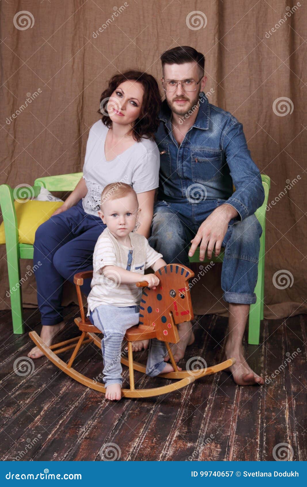 Happy Young Mother Father Sit On Bench And Little Son Stock Image