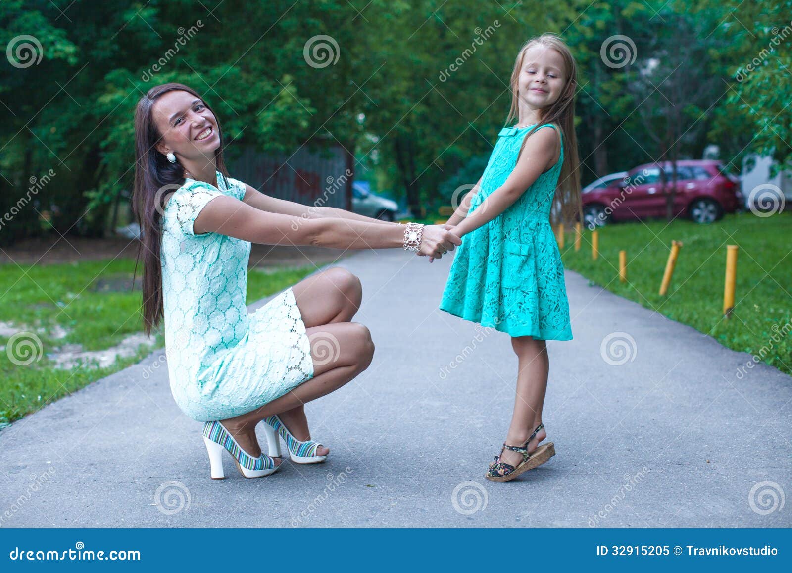 Happy young mother and her daughter having fun outdoors. This image has attached release.