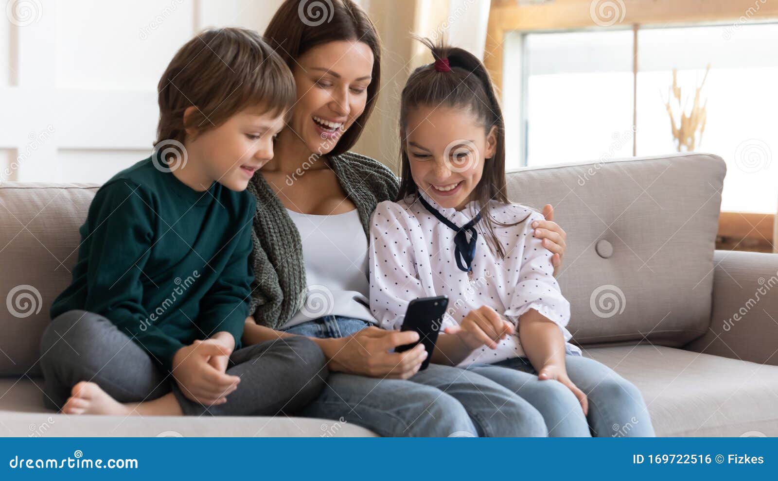 Happy Mother and Little Kids Have Fun Using Cell Stock Photo - Image of nanny, babysitter: 169722516 Happy Mother and Little Kids Have Fun Using Cell Stock Photo - Image of nanny, babysitter: 169722516