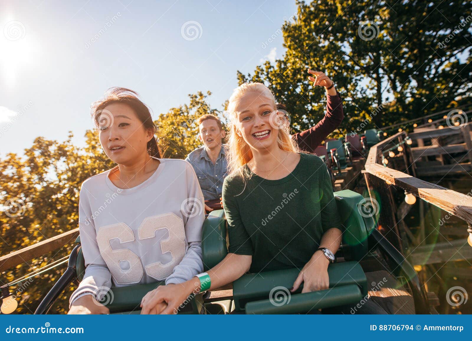 Happy Young People Riding a Roller Coaster Stock Photo - Image of ...