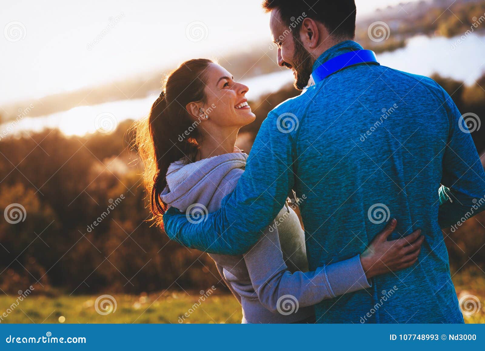 Happy Young Sporty Couple Sharing Romantic Moments Stock Image I