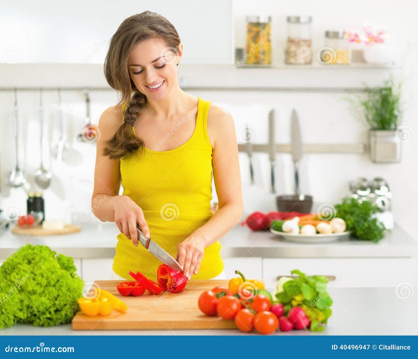 Happy Young Woman Cutting Fresh Vegetables Stock Image - Image of