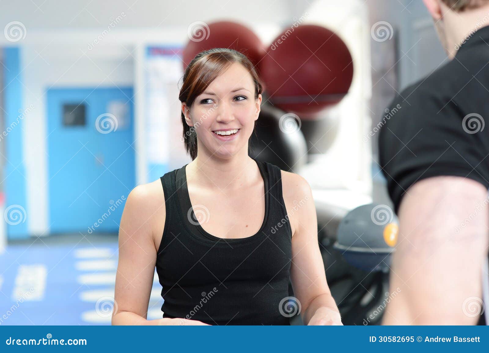 Happy Female Personal Trainer Inside Gym Stock Photo, Picture and Royalty  Free Image. Image 13737902.