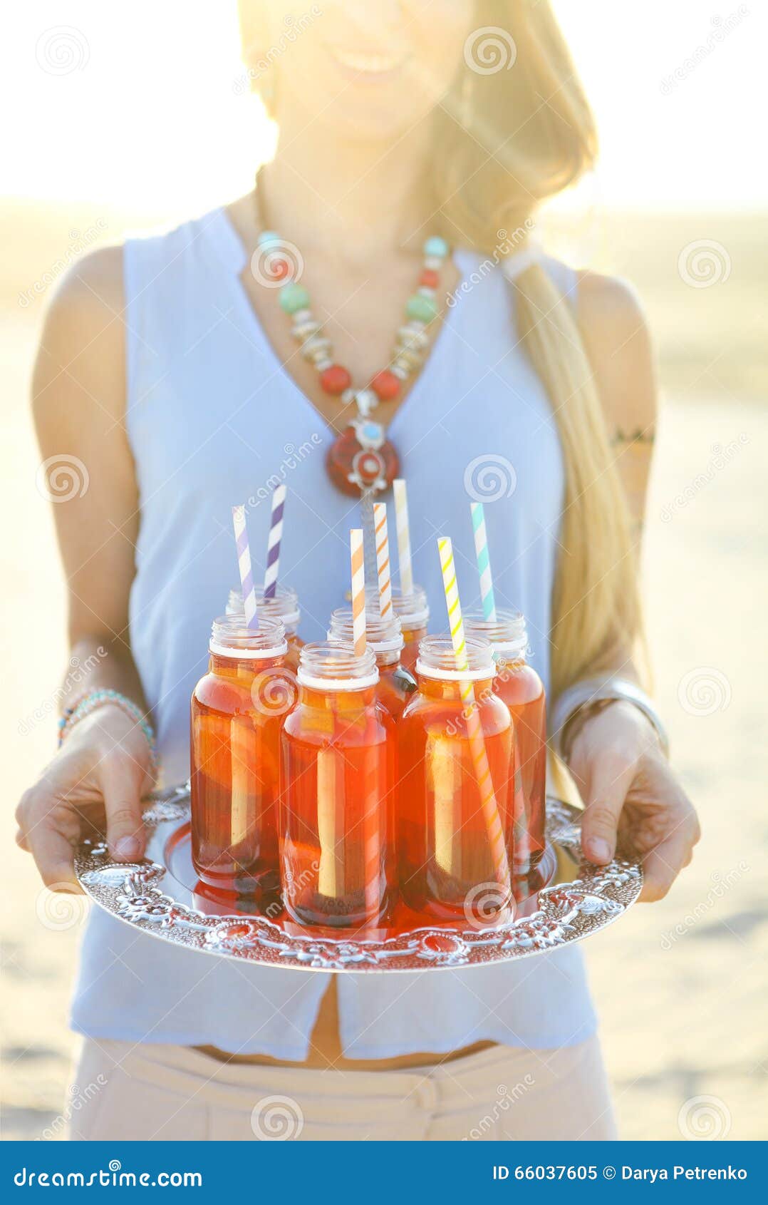 Happy Young Woman Holding a Dish with a Drinks at Sunset Party Stock ...