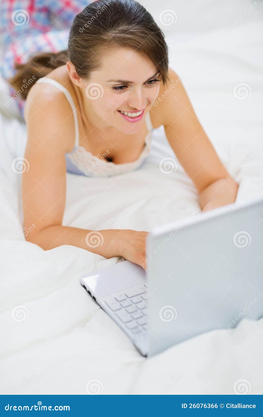 Happy Young Woman Laying on Bed and Using Laptop Stock Photo Image of