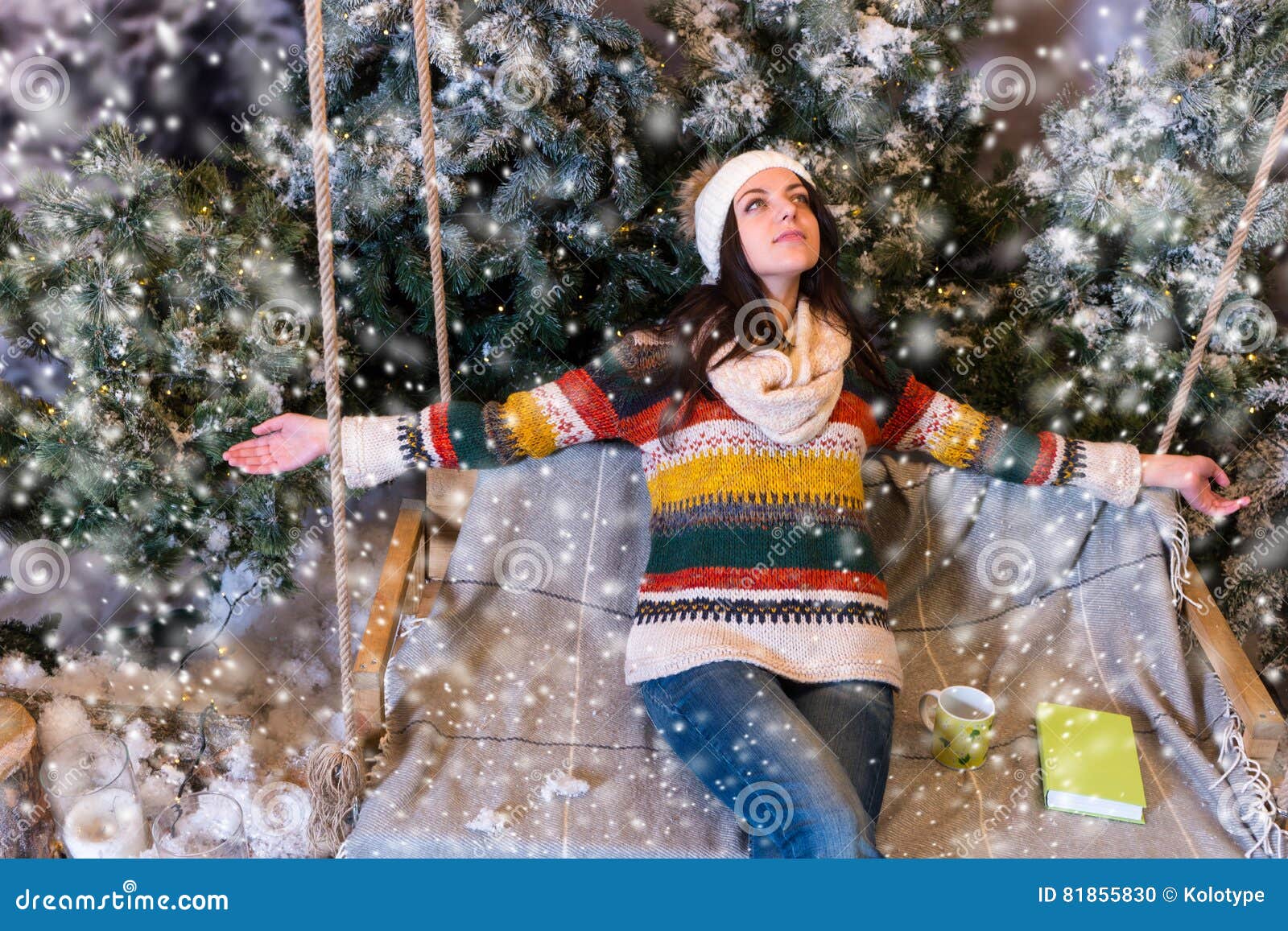 Happy Young Woman Lie Down with Arms Outstretched on a Swing in Stock ...