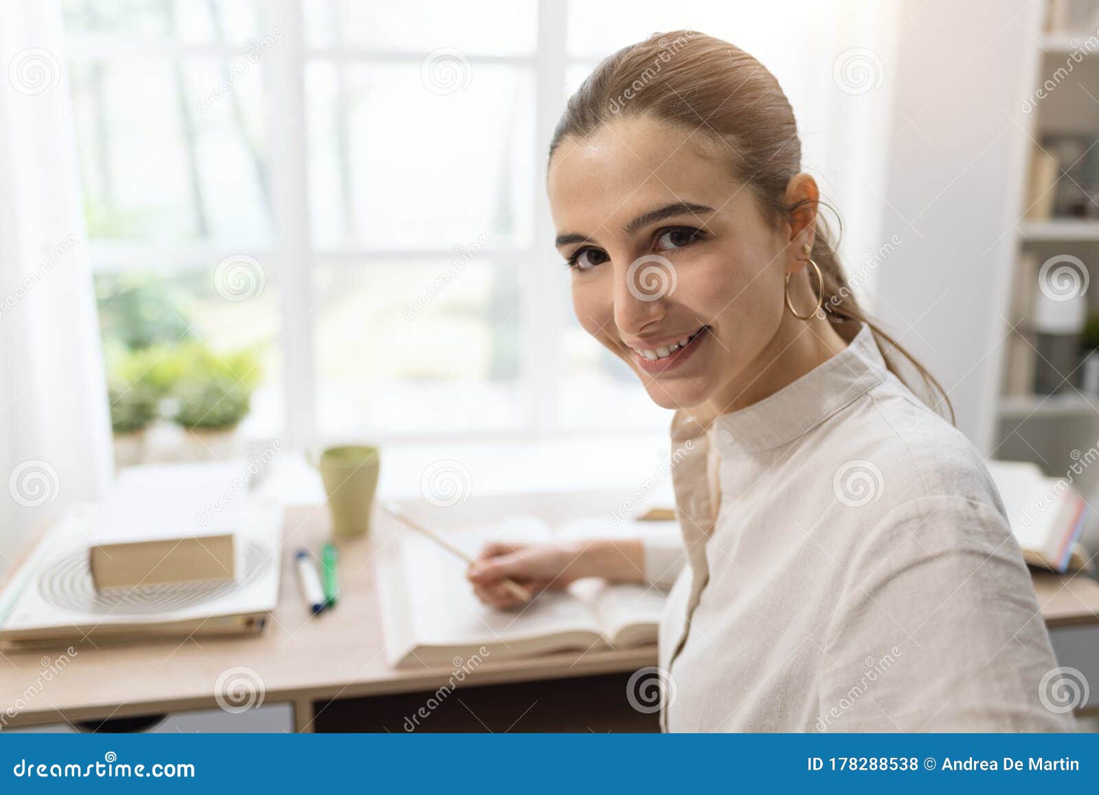 Woman Studying at Home and Smiling Stock Photo - Image of studying ...
