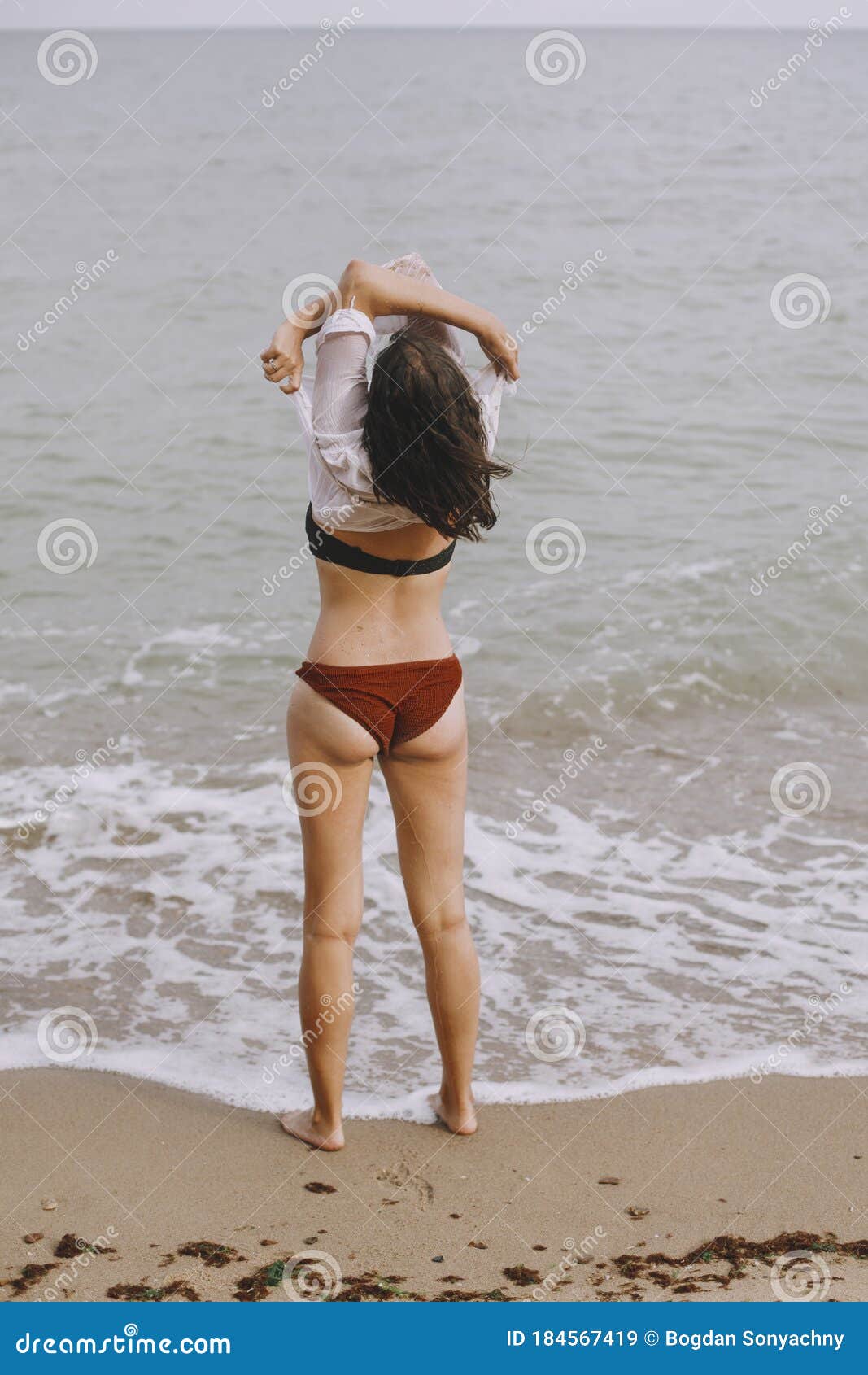 Taking Off Swimsuit Beach Stock Photos - Free & Royalty-Free Stock