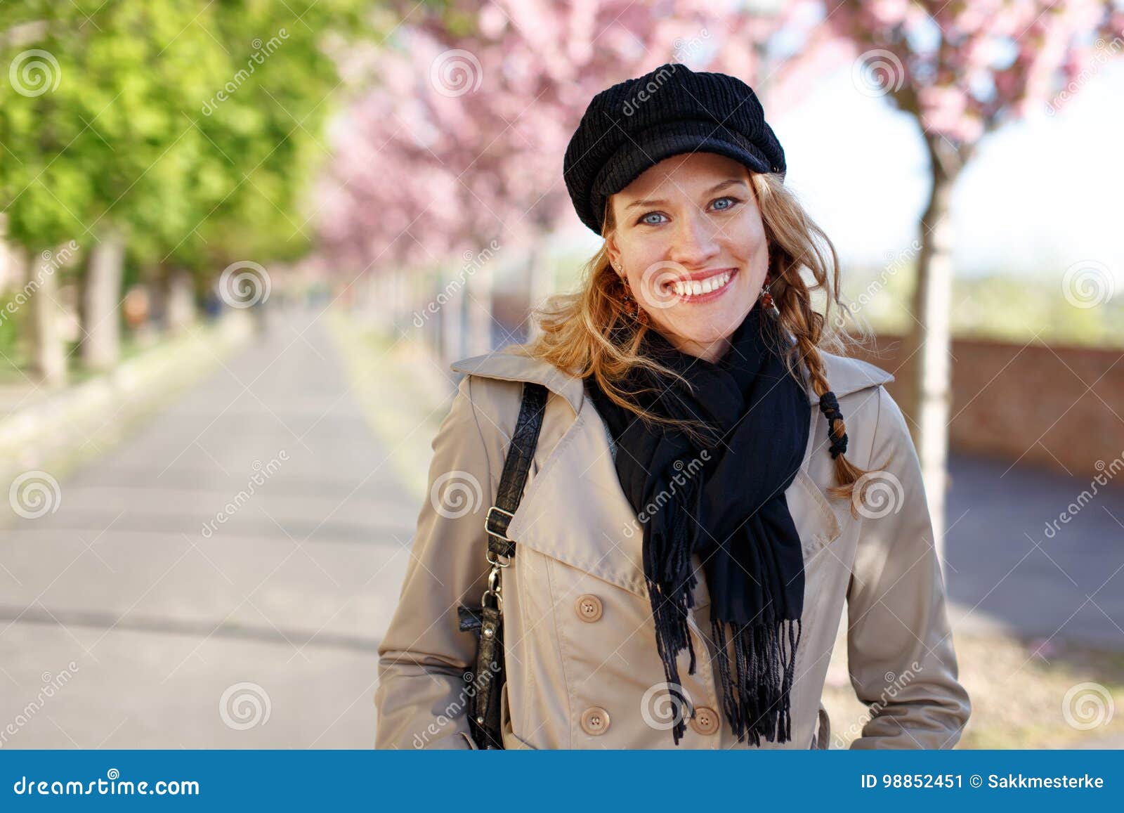 happy young woman toothy smile at early spring