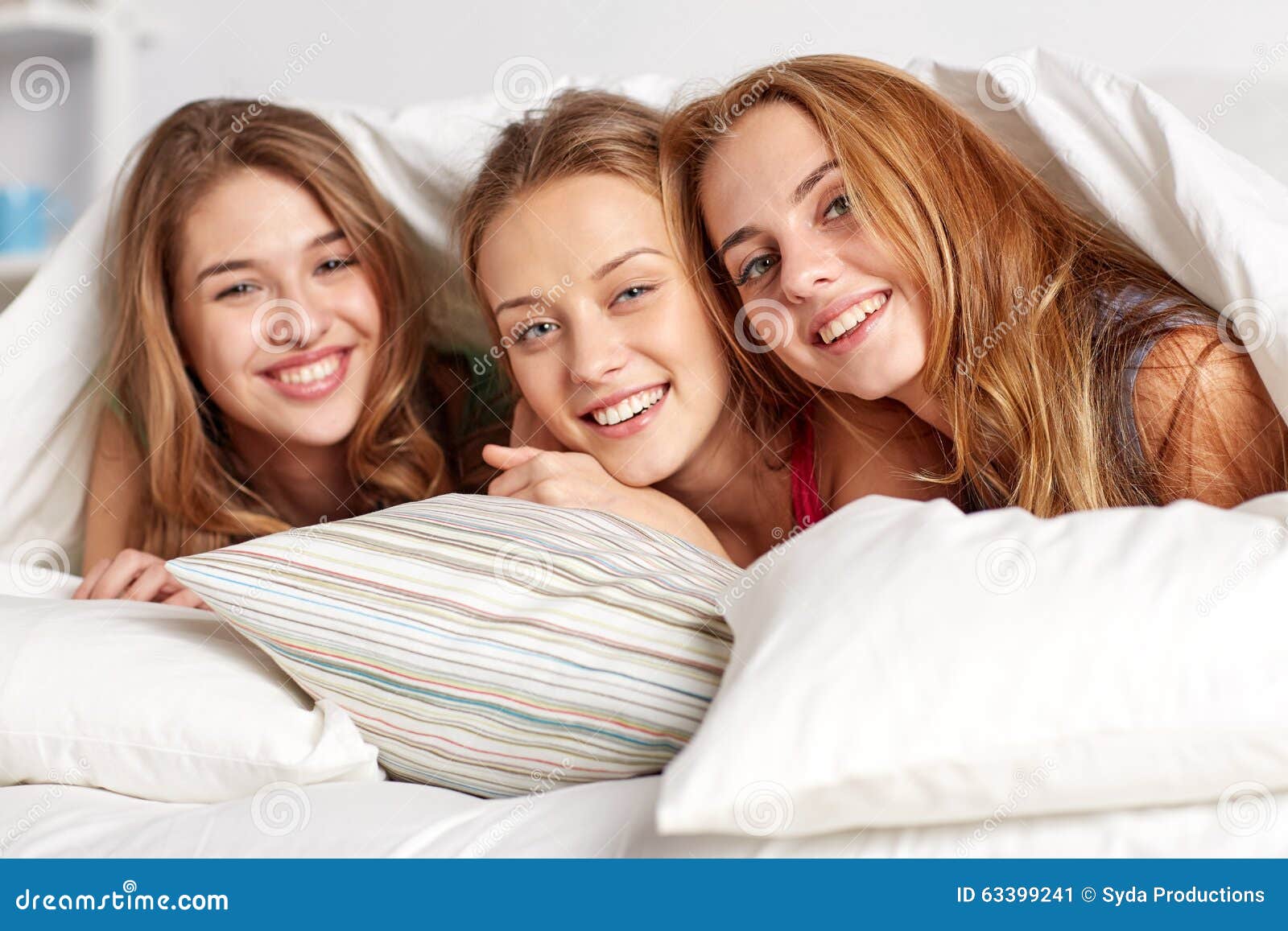 Happy Young Women In Bed At Home Pajama Party Stock Ima