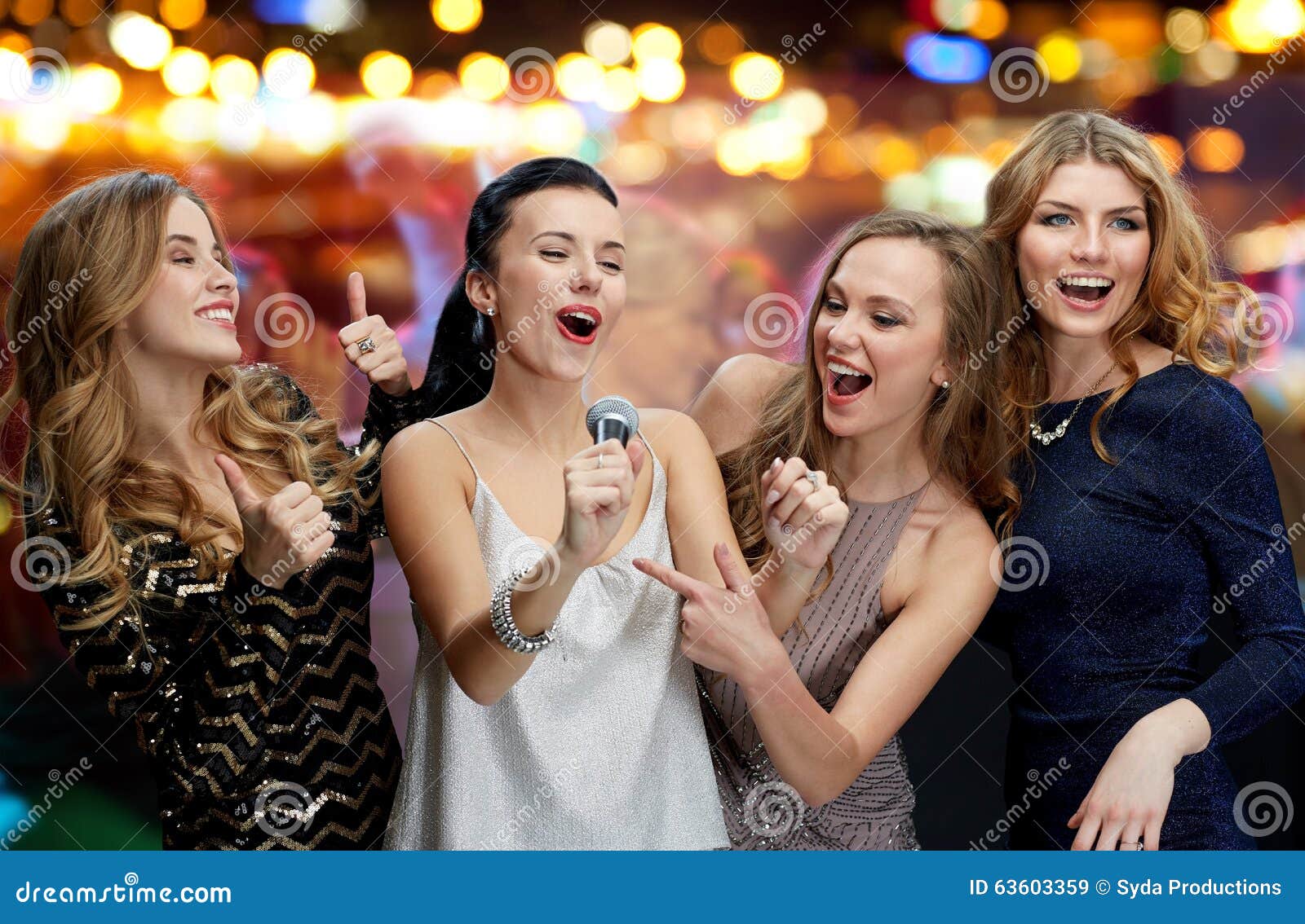 Happy Young Women with Microphone Singing Karaoke Stock Image Image
