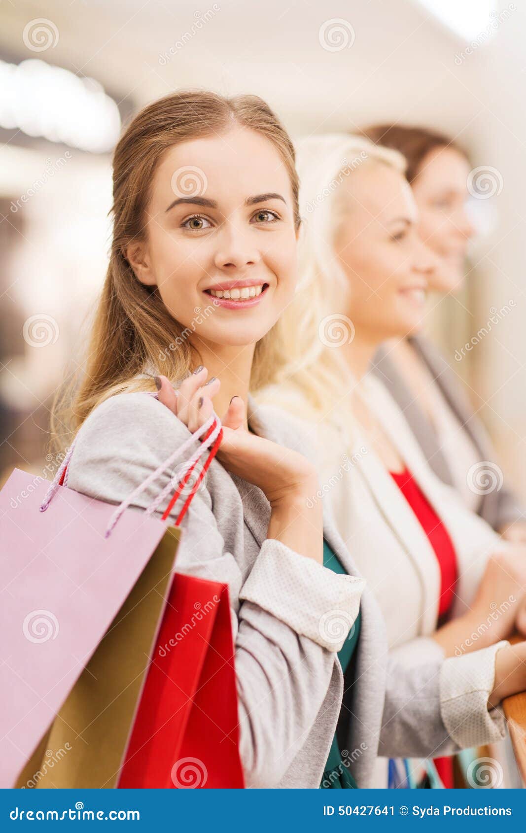 Happy Young Women with Shopping Bags in Mall Stock Image - Image of ...