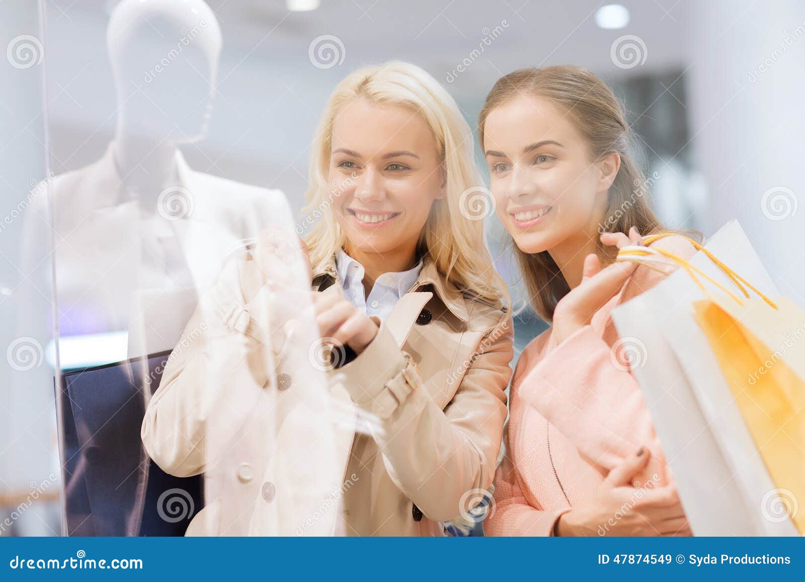 Happy Young Women with Shopping Bags in Mall Stock Image - Image of ...