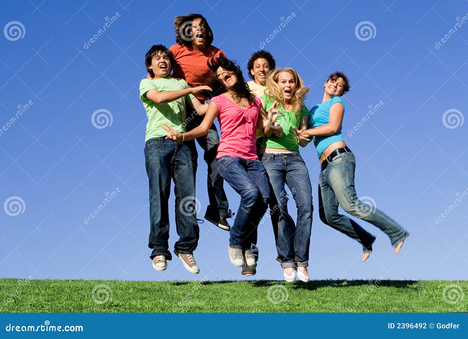 Happy youth group jumping stock photo. Image of girls 2396492