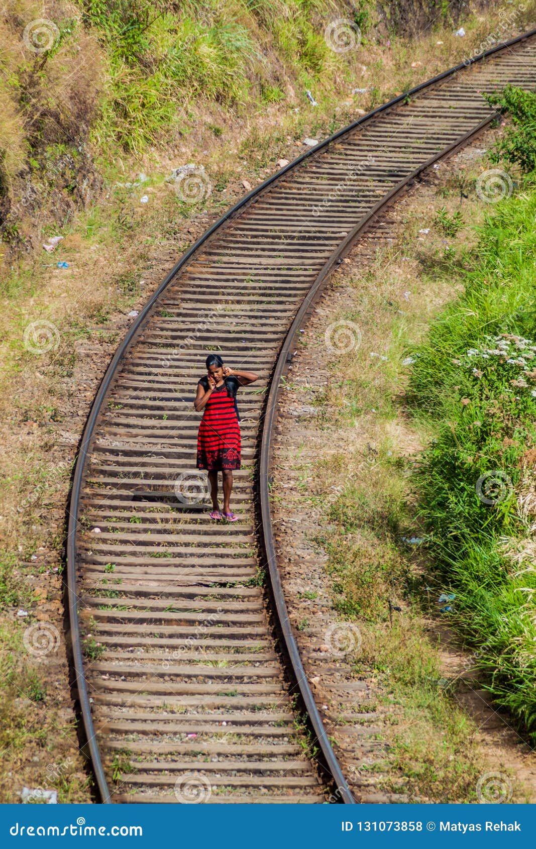 Woman Walking Along Railway Tracks Stock Photo - Image of 