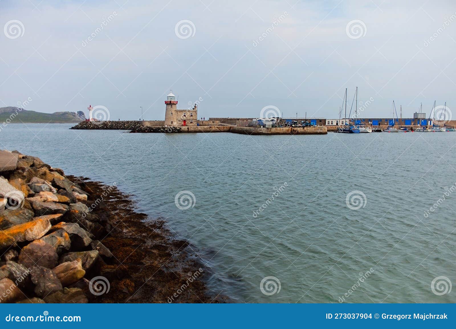Howth Lighthouse. Harbor and Marina in Cloudy Day in Howth, Dublin