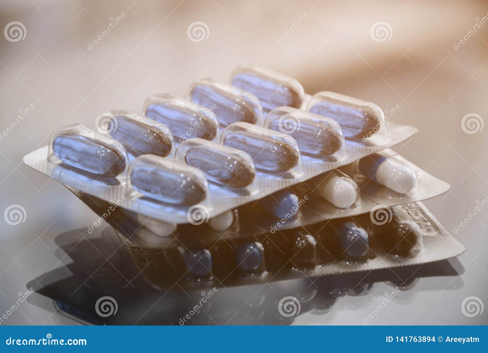 Hard Gelatin Capsule and Soft Gelatin Capsule in Strips Stock Photo