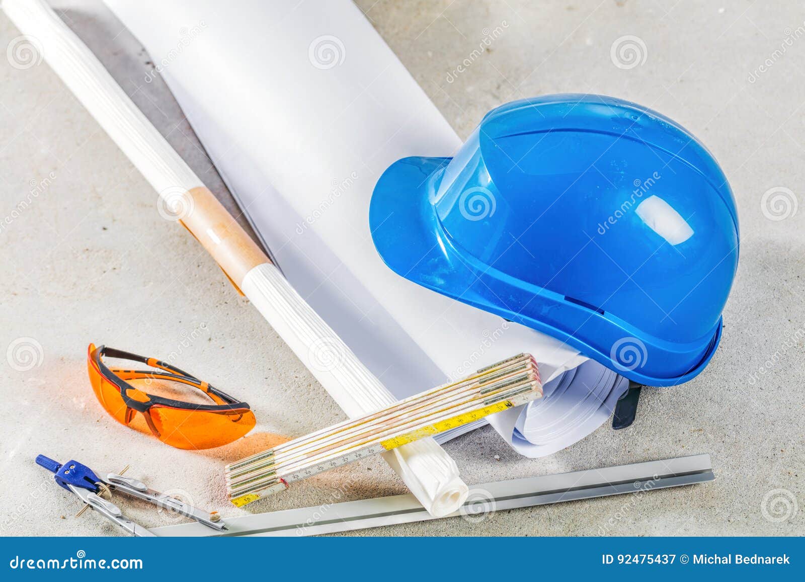 Hard Hat, Glasses and Blueprints at Construction Site. Stock Image