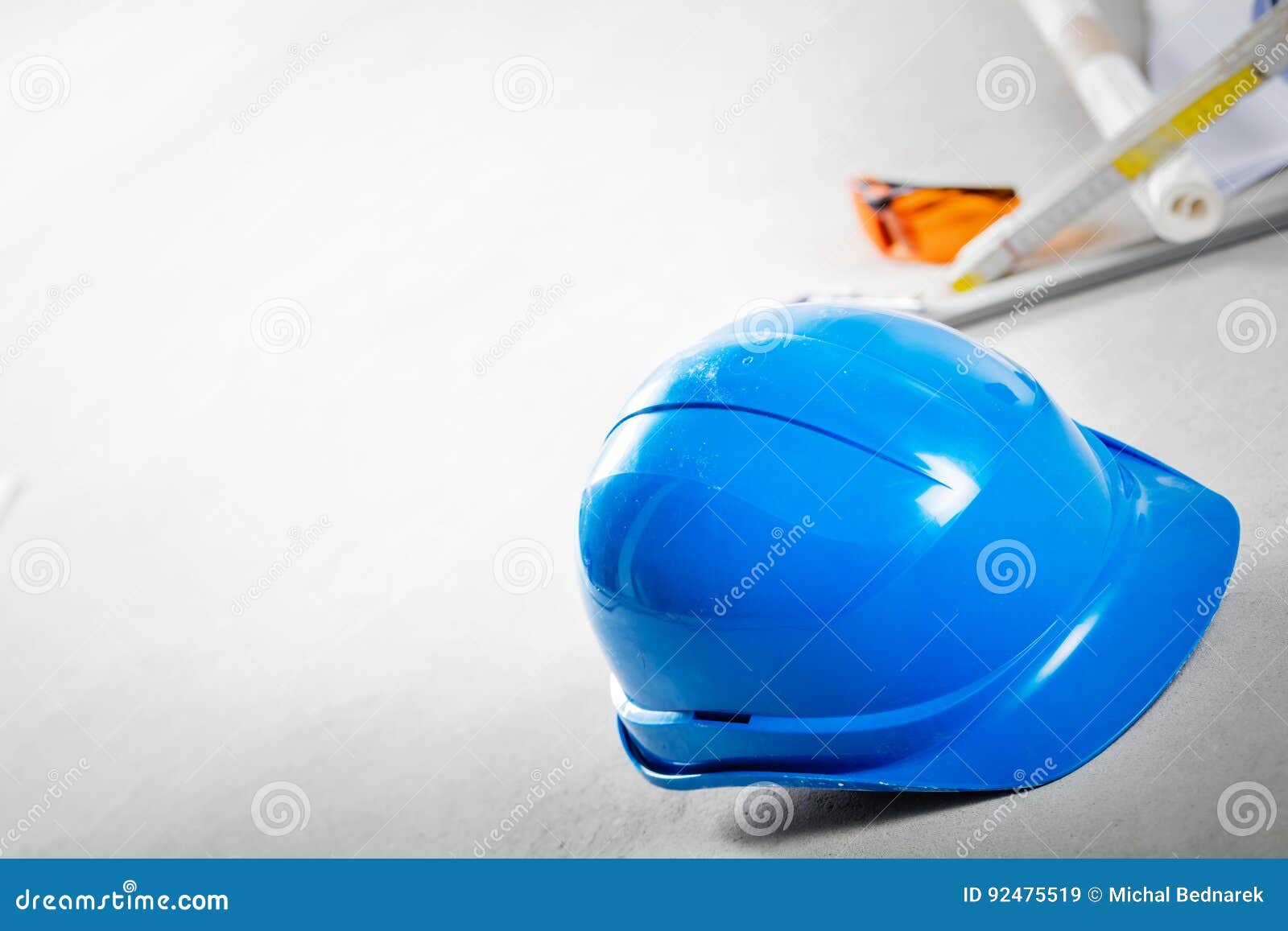 Hard Hat, Glasses and Blueprints at Construction Site. Stock Image