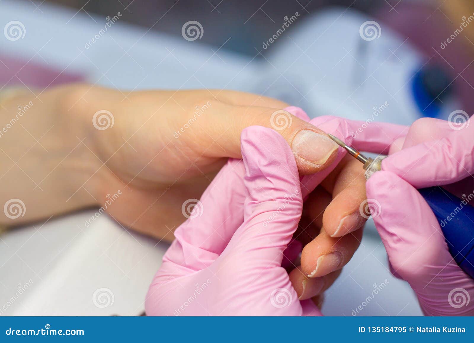 hardware manicure using electric device machine. procedure for the preparation of nails before applying nail polish. hands of