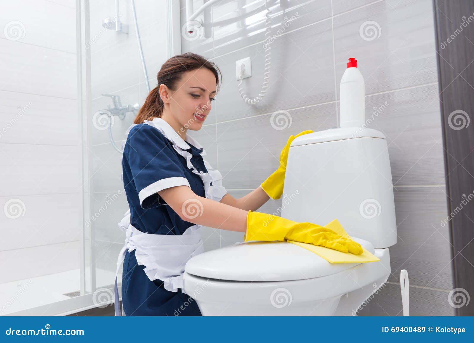 Hardworking Housekeeper Cleaning A Toilet Seat Stock Image 