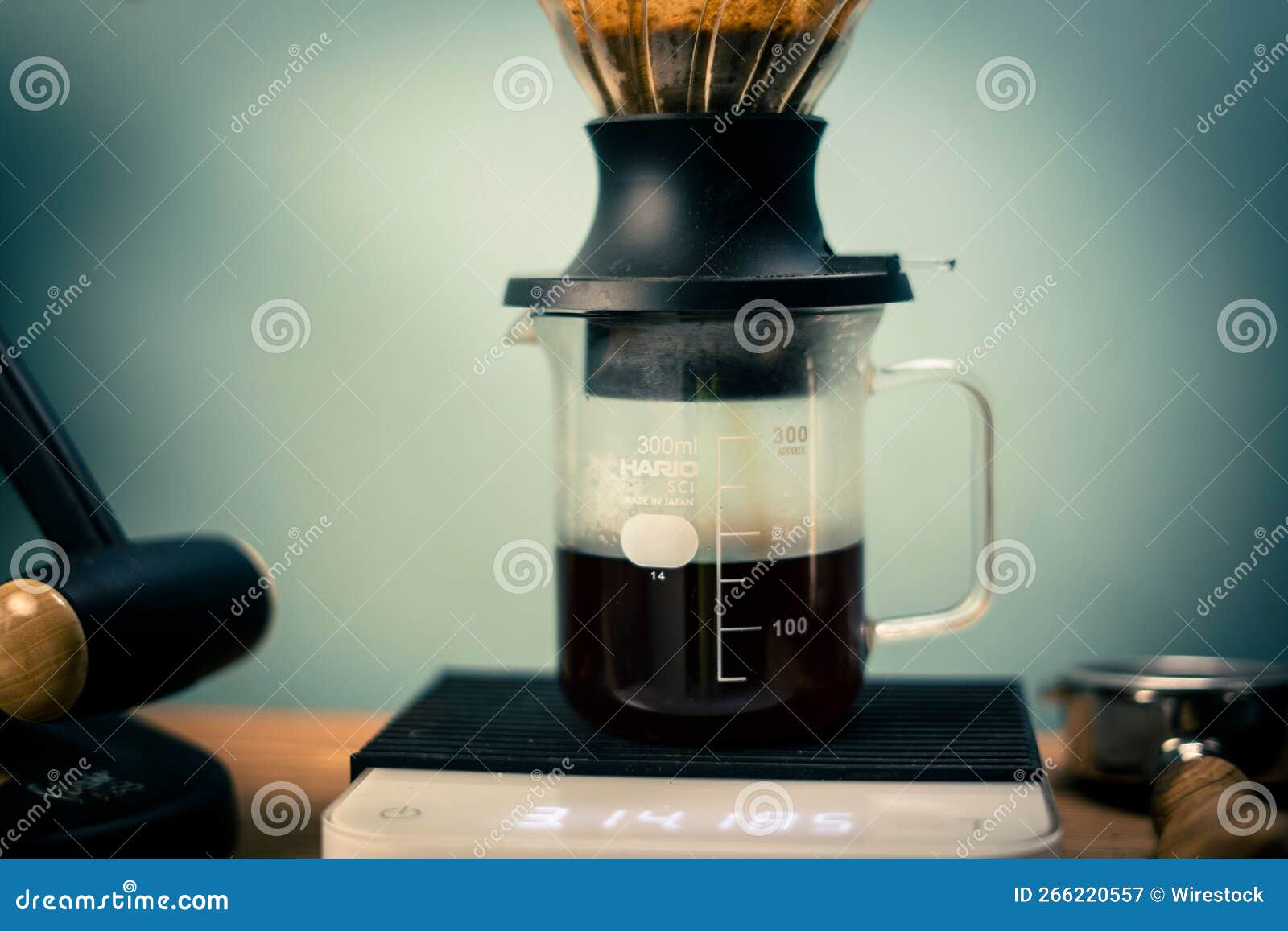Hario V60 Immersion Dripper Preparing Coffee on the Blurred Background