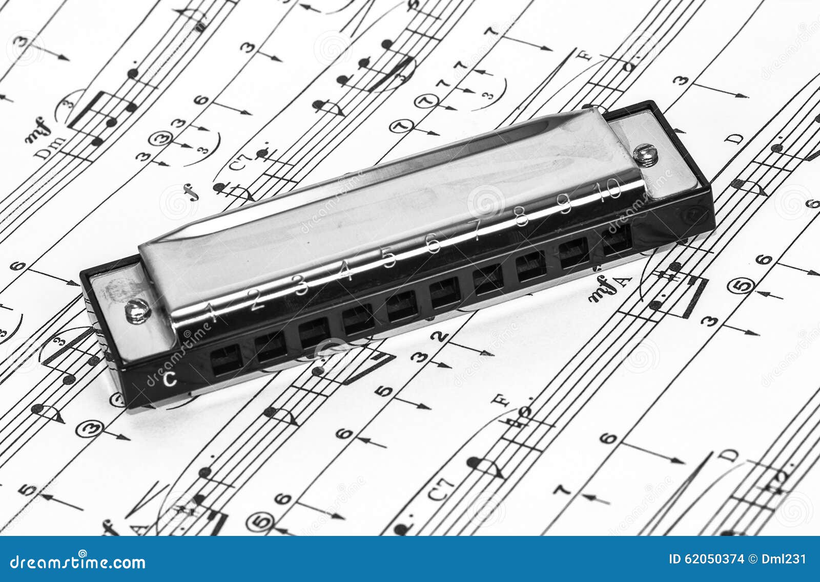 harmonica-on-sheet-music-stock-photo-image-of-clef-entertainment