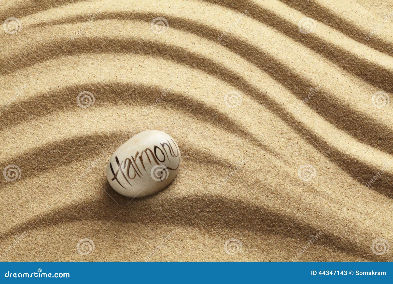harmony pebble on sand