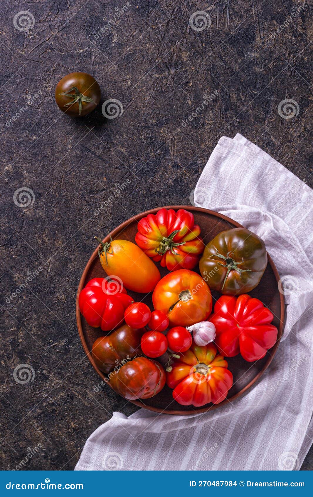 The Harvest of Assorted Tomatoes. Colorful Organic Tomatoes on a Large