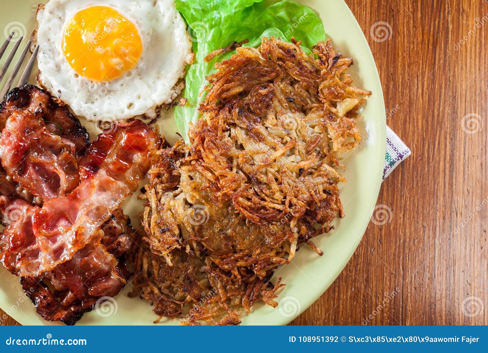 Hash Browns. Potato Pancakes with Crispy Fried Bacon and Fried E Stock