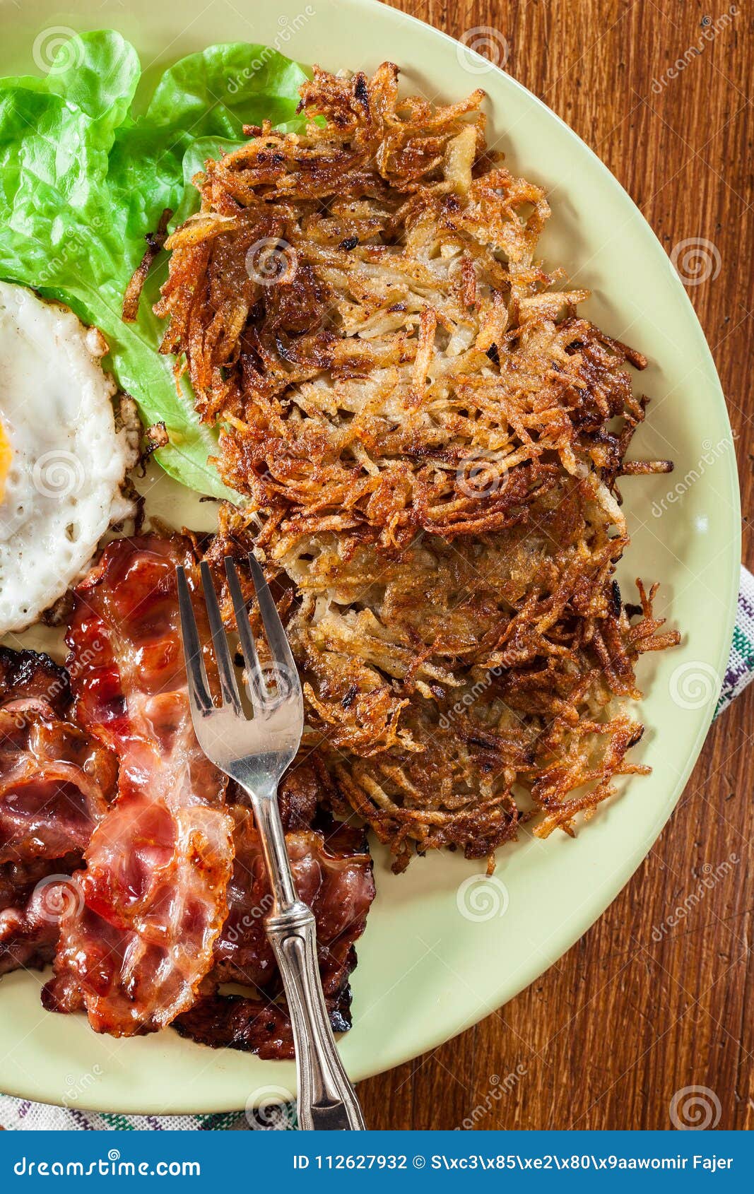 Hash Browns. Potato Pancakes with Crispy Fried Bacon and Fried E Stock