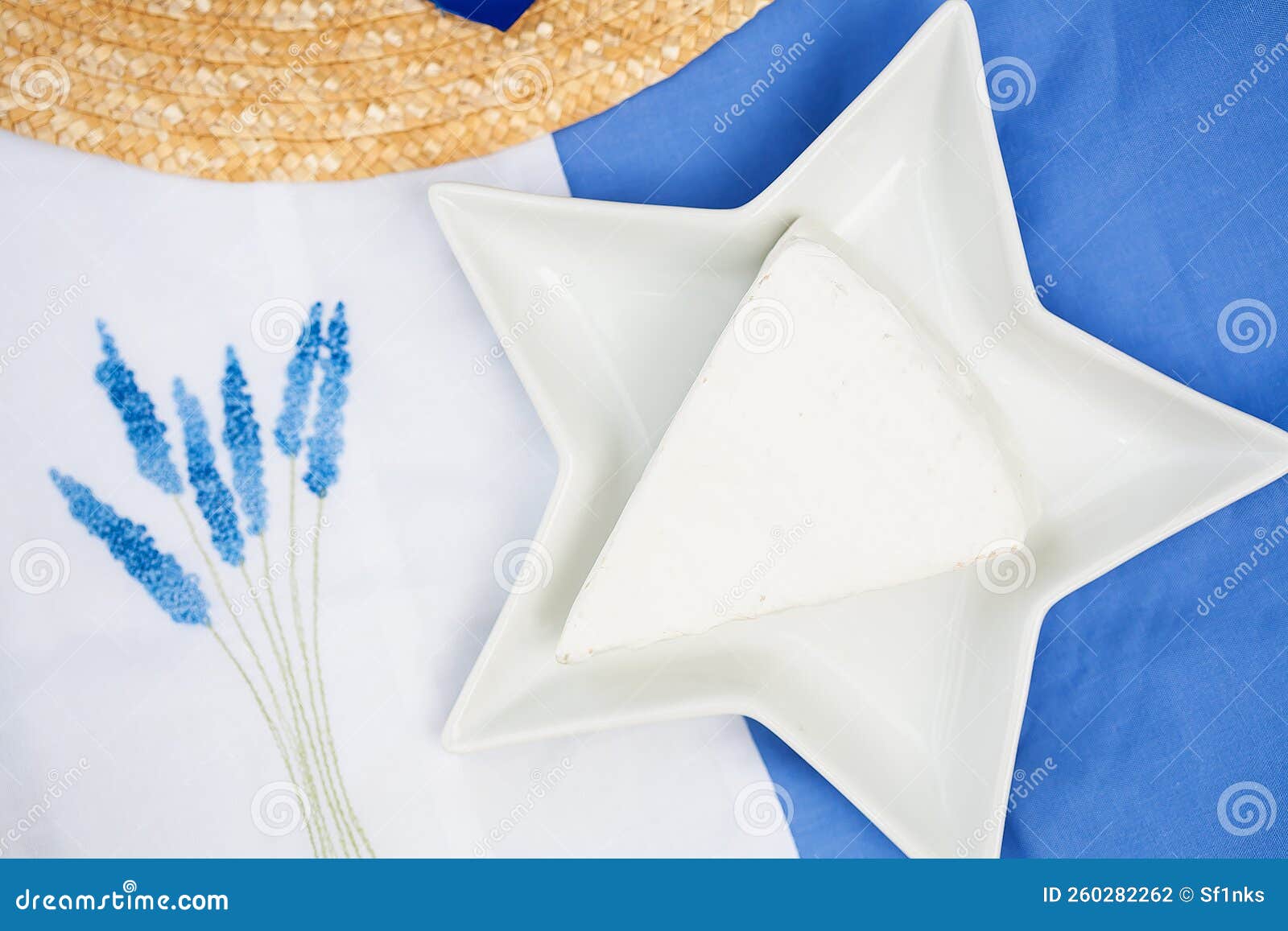 Hat, Brie Cheese in a Plate on Blue Tablecloth Stock Photo Image of