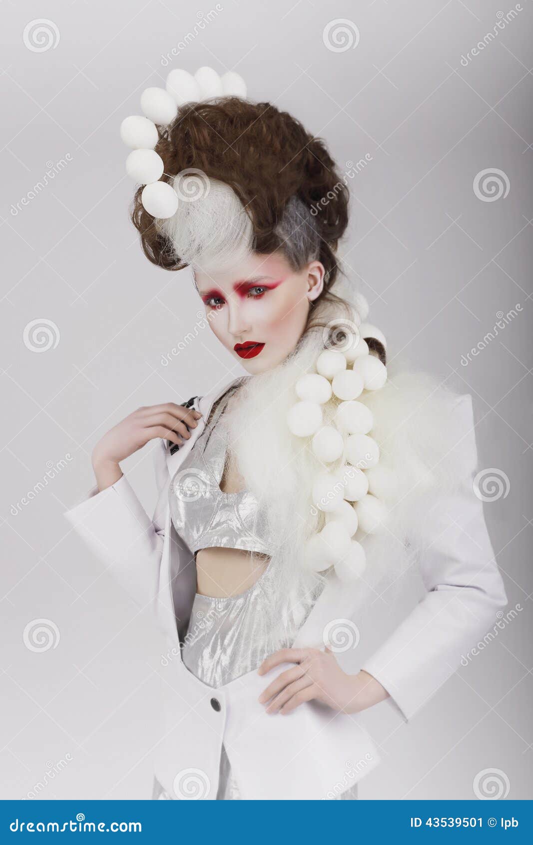 haute couture. extravagant woman in cyber costume and theatrical hair-do