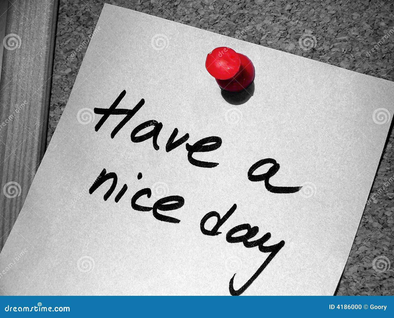 Have a nice day tag with a red pin on the cork message board.