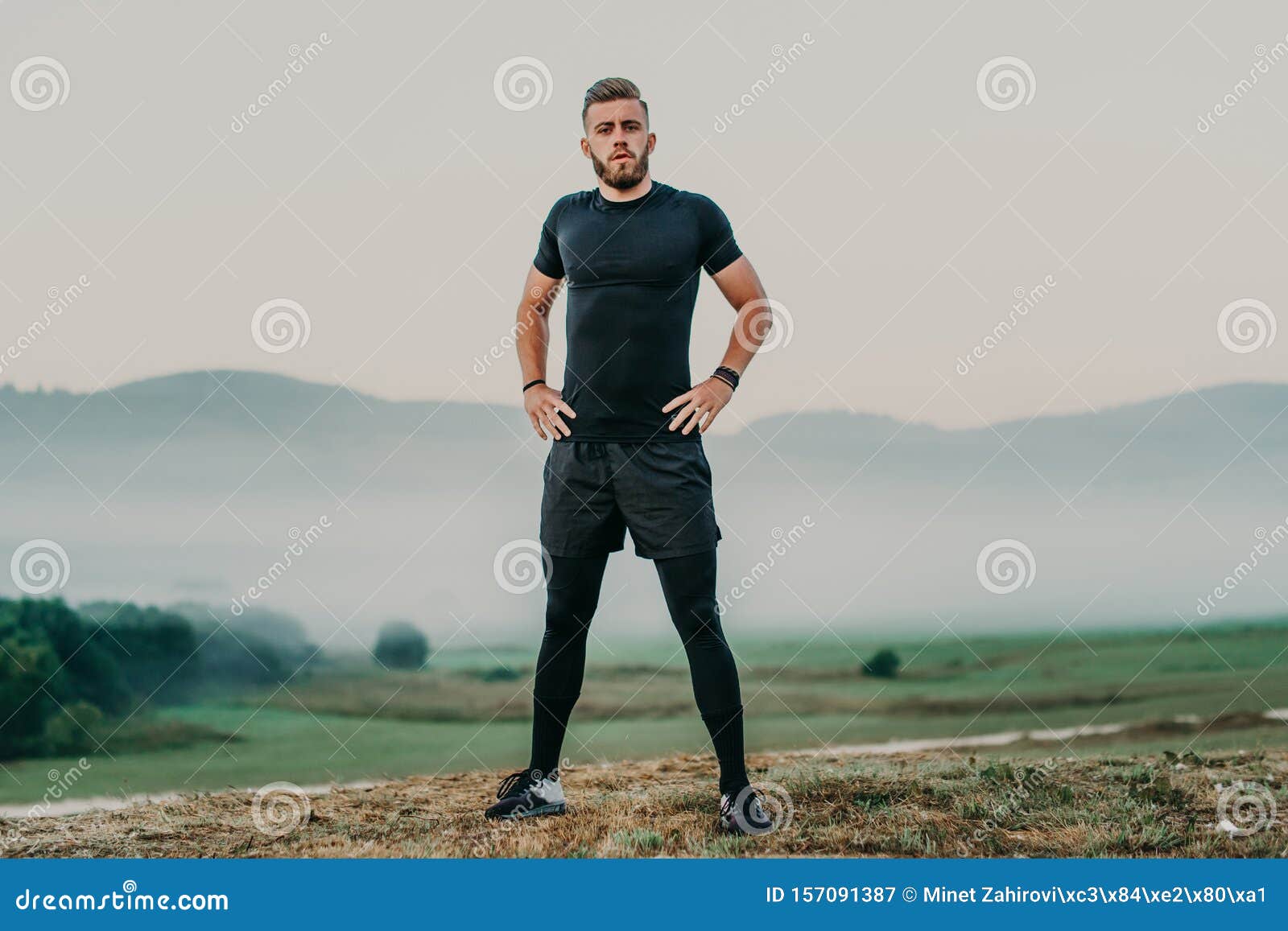 Having a Good Stretch. Handsome Young Man in Sports Clothing Stretching ...