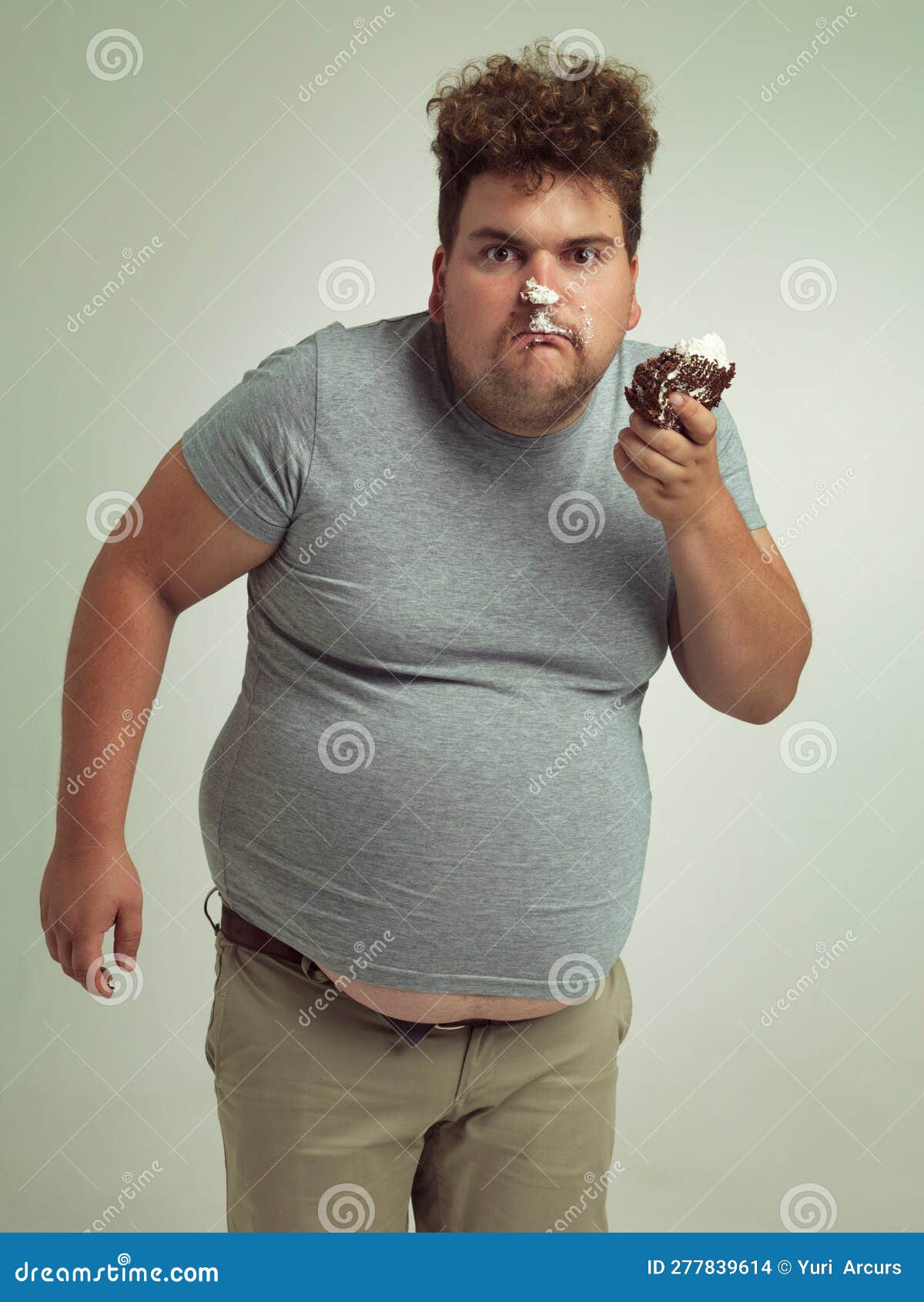 Having My Cake and Eating it. an Overweight Man Messily Eating a Slice ...