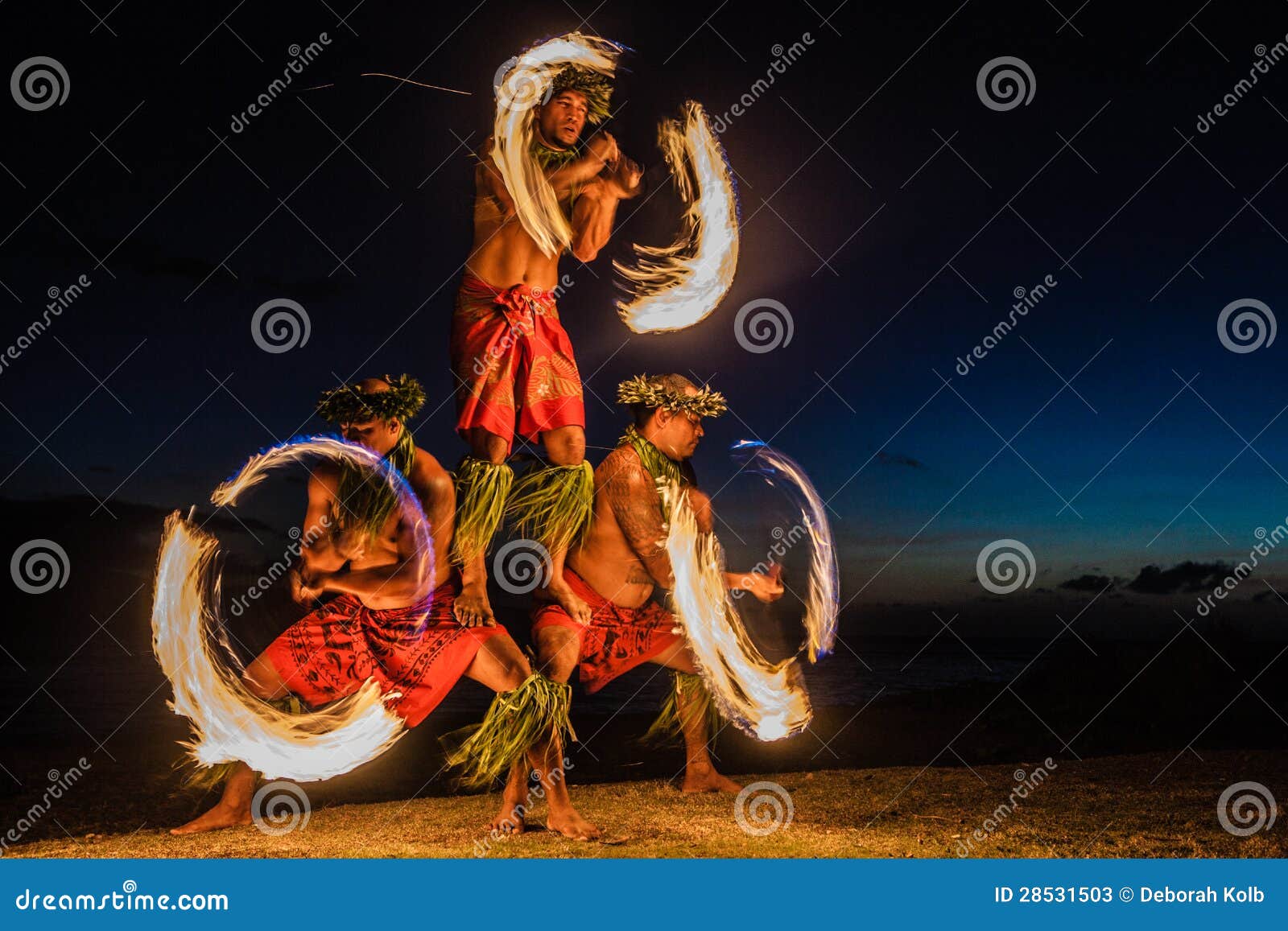 hawaiian fire dancers in the ocean