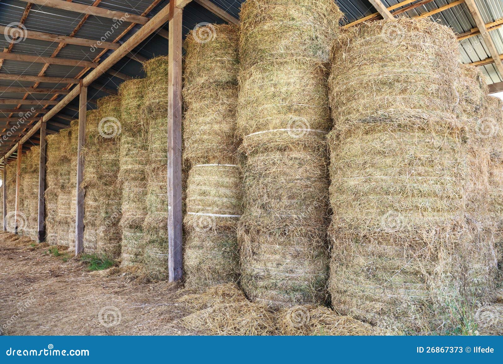 Hay Bale Stacked In Barn Stock Photos - Image: 26867373