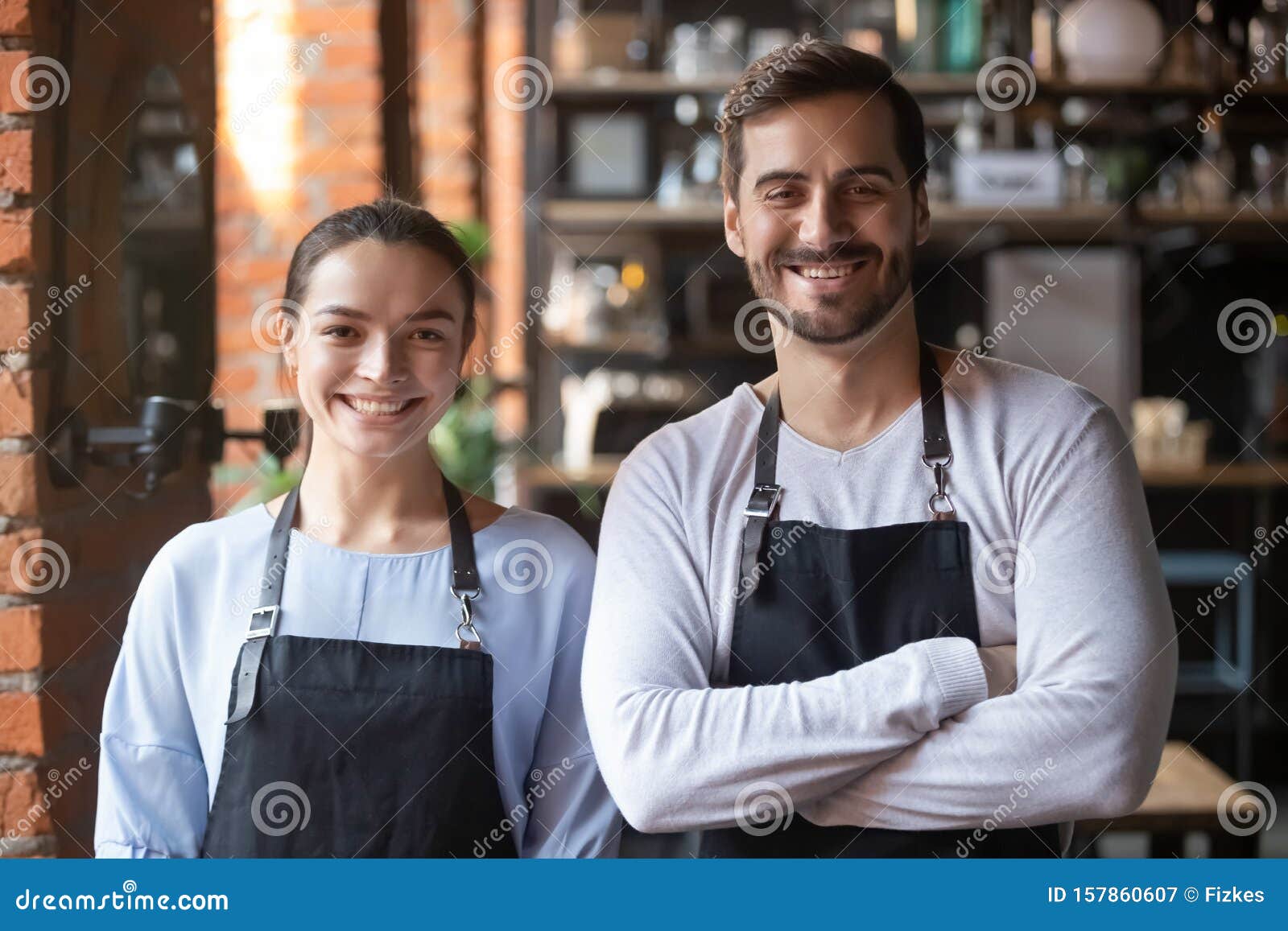 head shot portrait of coffeehouse workers, smiling waiter and waitress