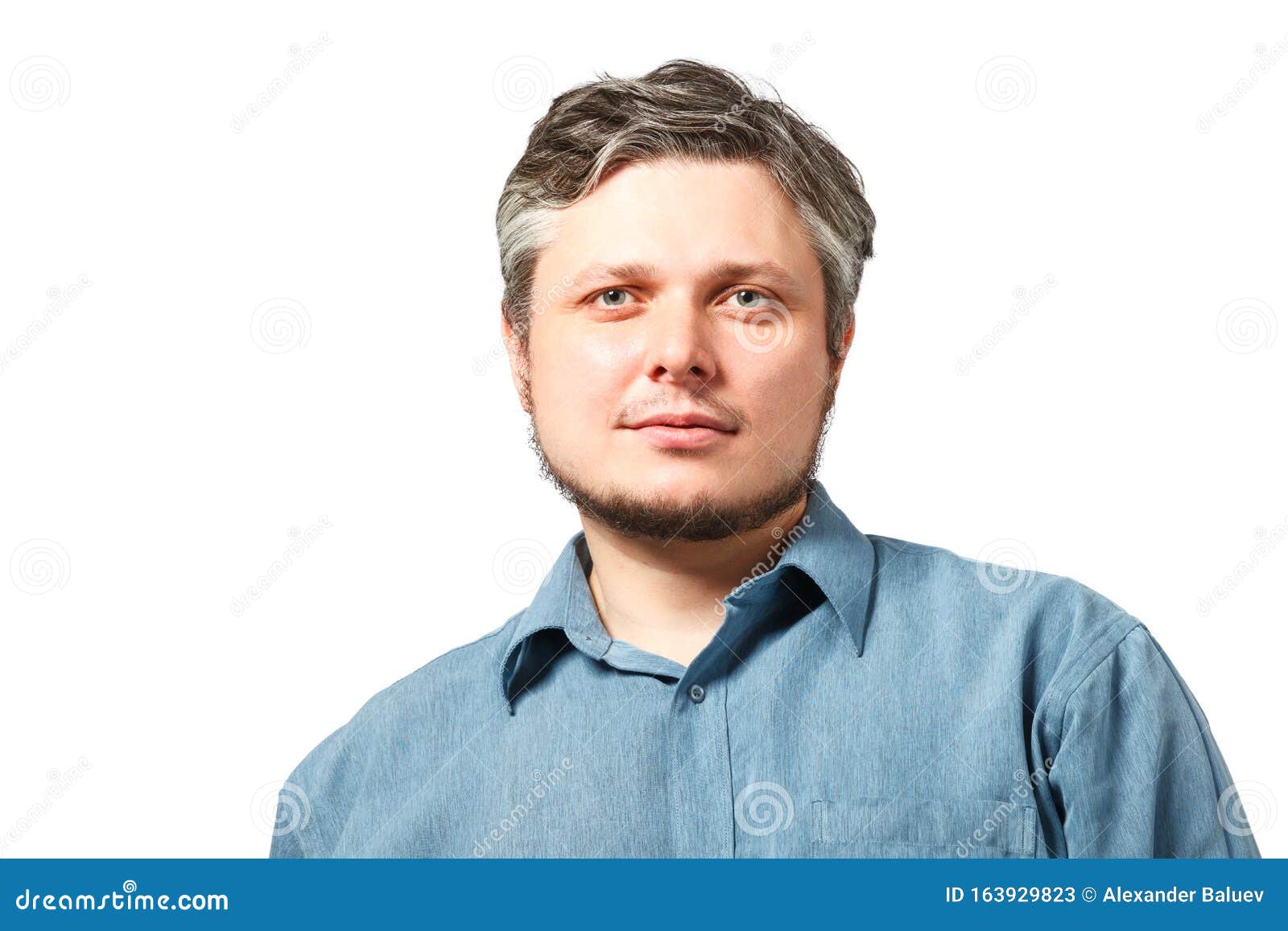 Head and Shoulders Portrait of a Bearded Middleaged Man Over a White