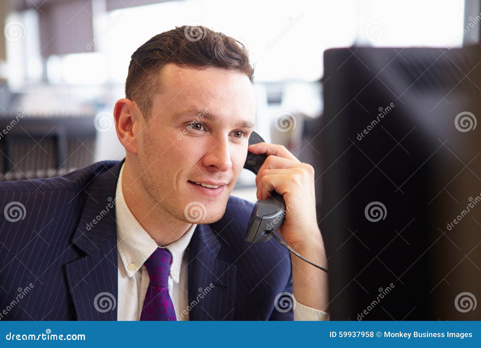 Head and Shoulders of a Young Businessman, Using Telephone Stock Photo ...