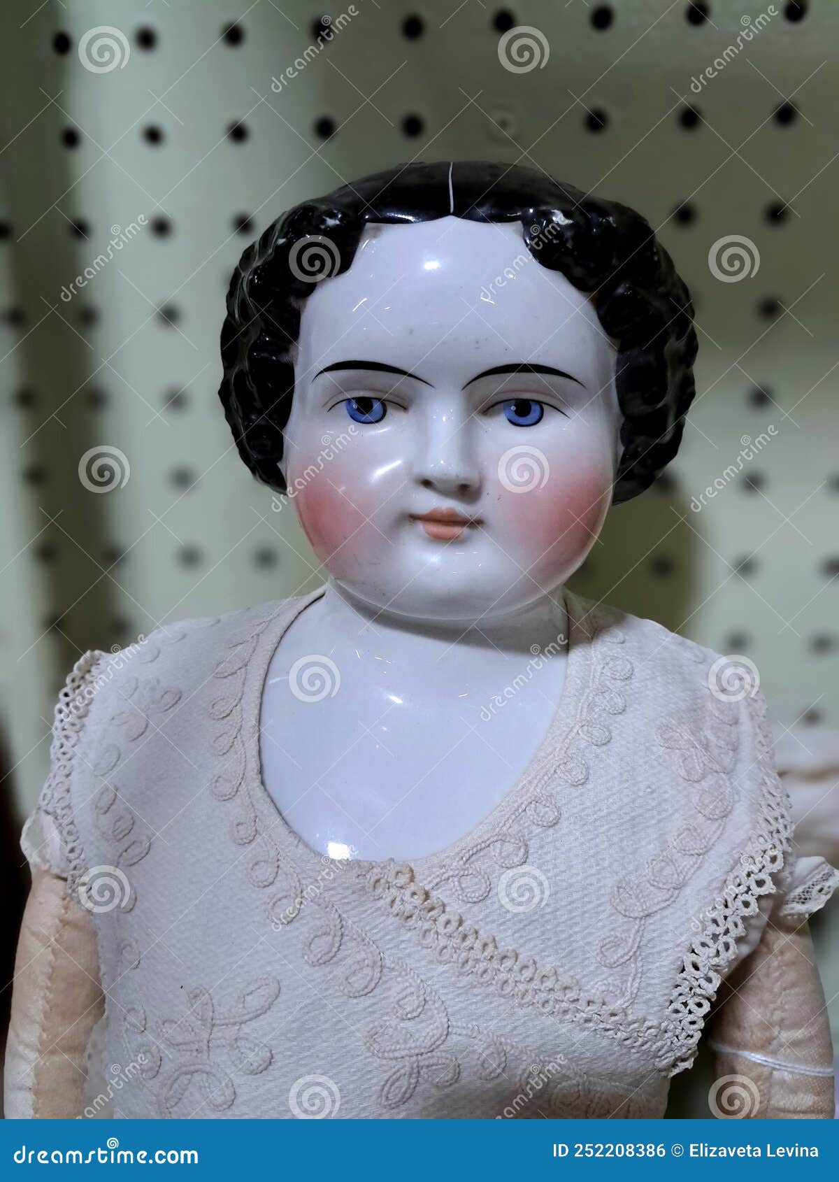 Head and Torso of an Antique Porcelain Doll with Blue Eyes, Rosy Cheeks,  and Black Hair Stock Photo - Image of cheeks, chubby: 252208386