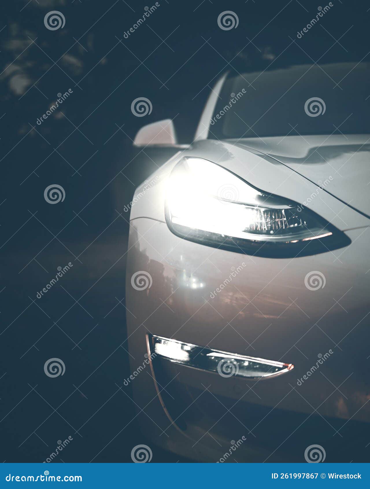 Headlight of a Modern Cool Car Illuminated in the Darkness Stock Image