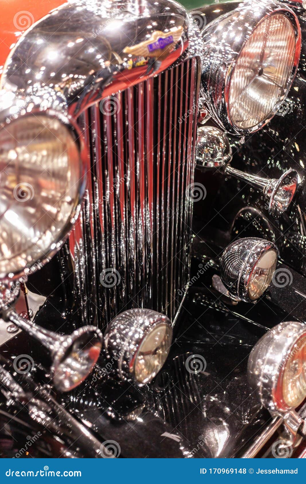 Headlights and Car Horns and Chromed Grill of Classic Car Stock Photo