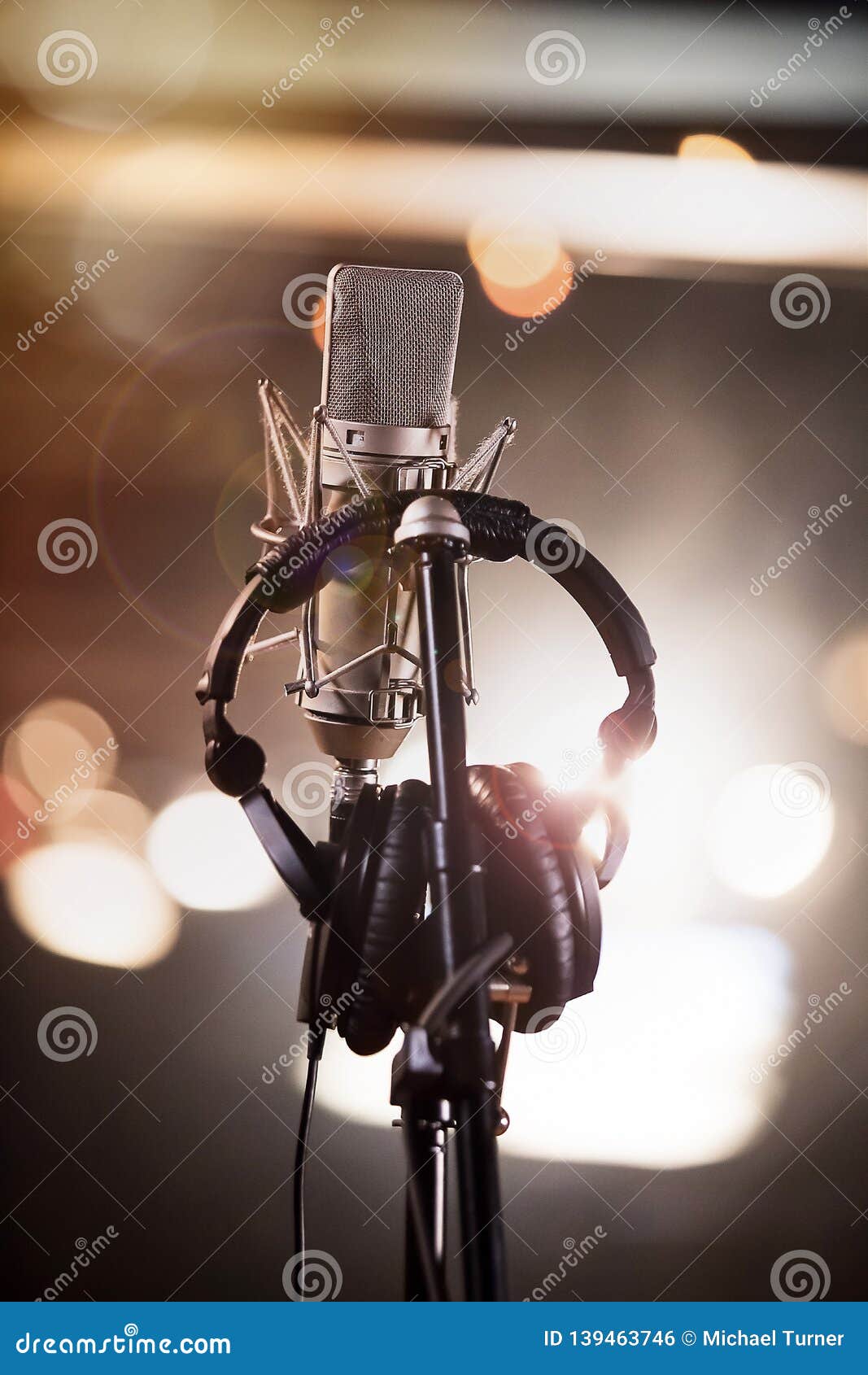 Headphones and Condenser Microphone in a Music Recording Studio Stock