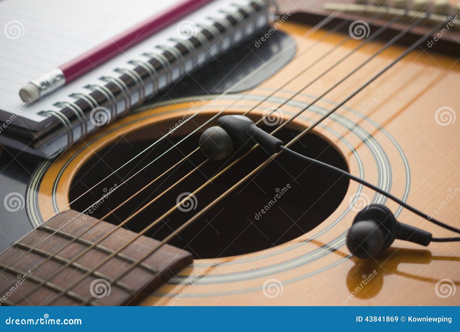 Headphones on guitar stock image. Image of madrigal, black 43841869