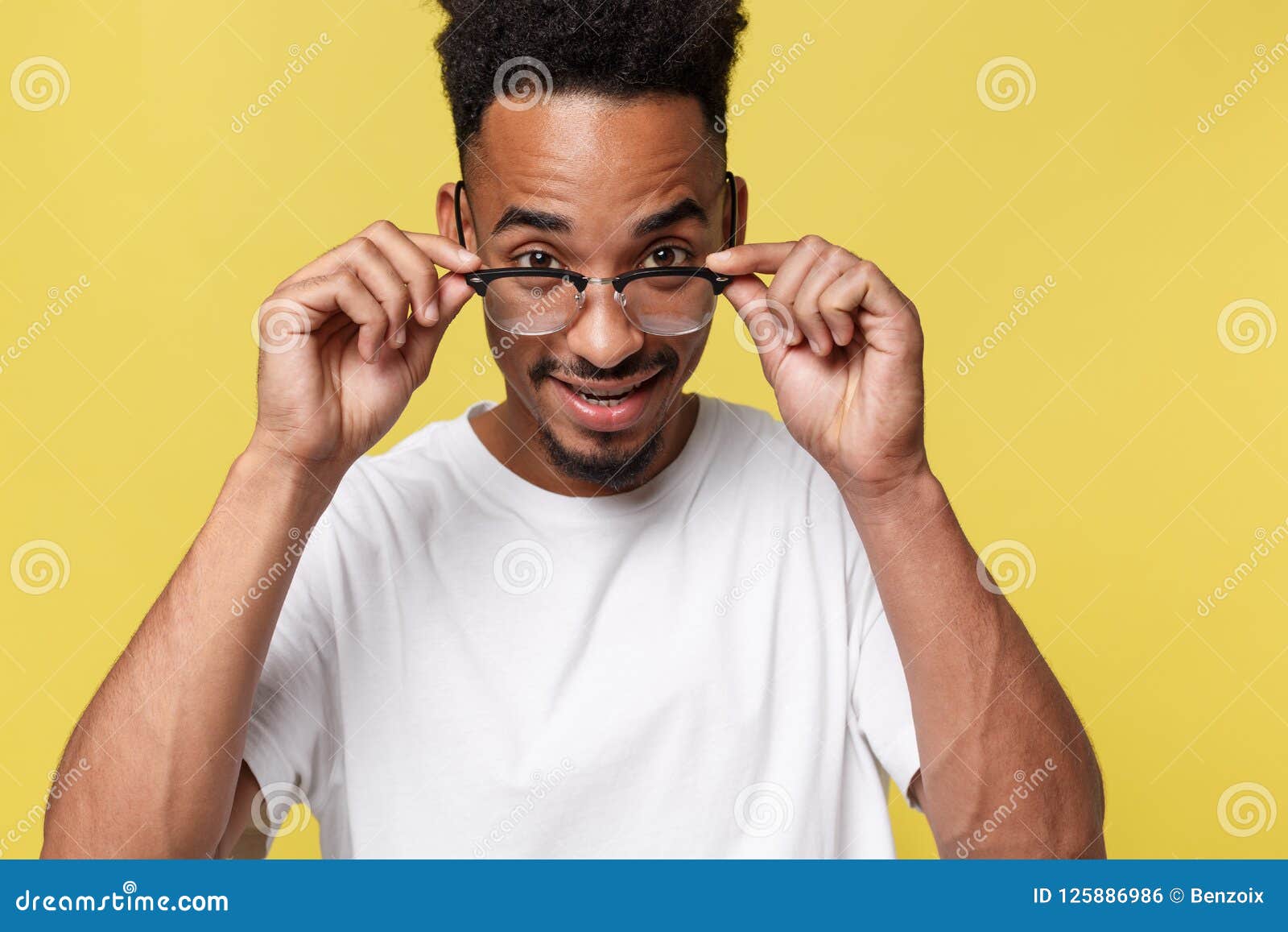 Headshot Of Good Looking Positive Young Dark Skinned Male